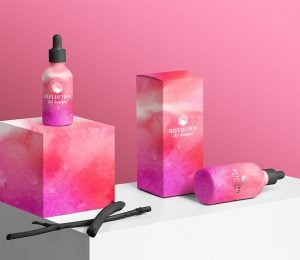 logo packaging of pink and white spray bottles product shot