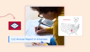 Arkansas LLC annual report person with glasses filling out a report with a calculator